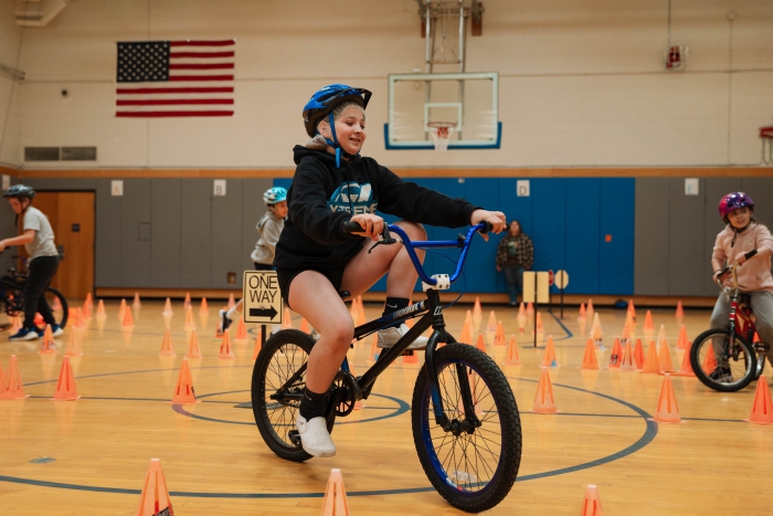 A SCCS elementary student practices bike skills and safety during the Bike Rodeo