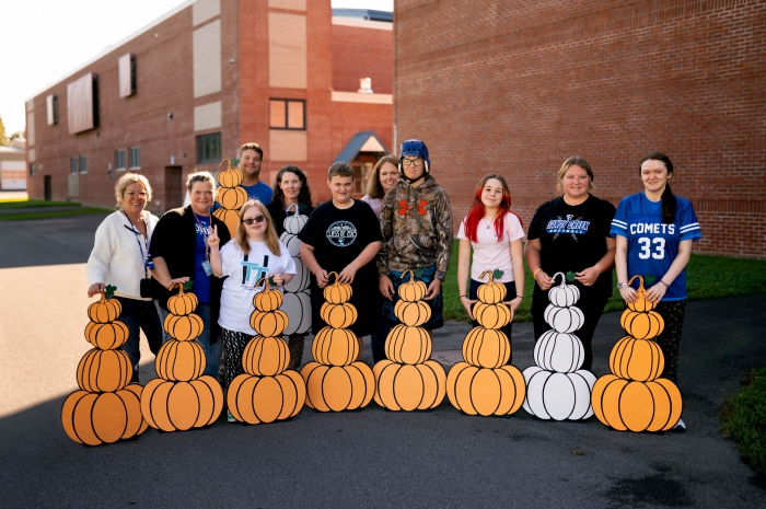 Start Vocational students show off their personalized pumpkin projects. 