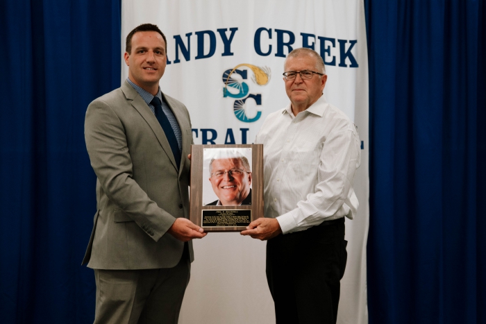 SCCSD Superintendent, Kevin Seymour (left), awards the Wall of Distinction plaque to Joel Hastings (right).  